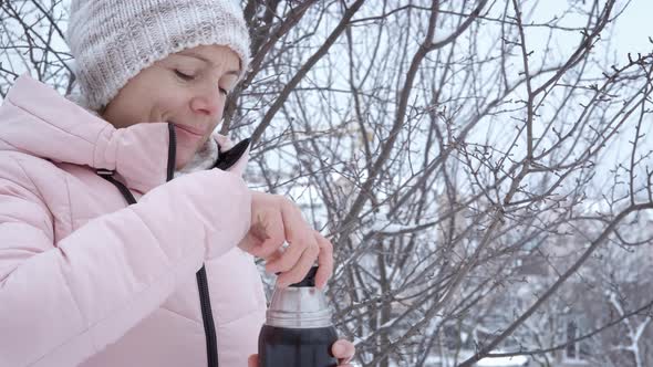 Drink Hot Tea From Thermos Outdoor