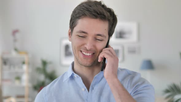 Handsome Young Man Talking on Phone