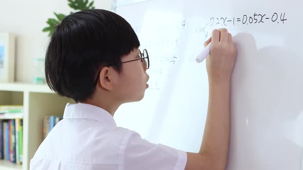 A boy who studies hard and solves math problems