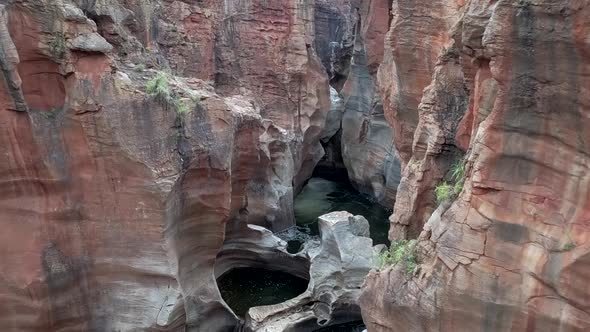 HD aerial drone footage revealing the beautiful natural rock formations of Bourke's Luck Potholes ca