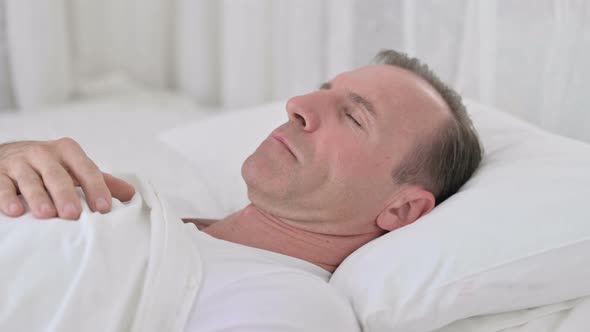 Comfortable Middle Aged Man Sleeping in Bed 