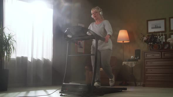 Senior Woman Exercising on Treadmill