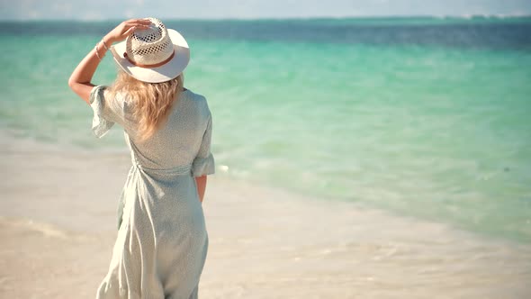 Tanned Woman In Dress. Relaxing On Zanzibar Kiwengwa. Have Great Time On Sea Trip. Holiday Vacation