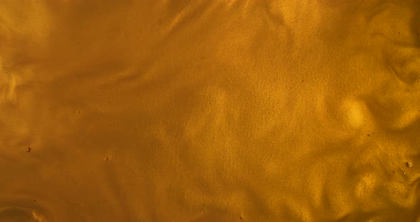 Liquid gold wave background. Golden and abstract backdrop that suits as lava honey or oil