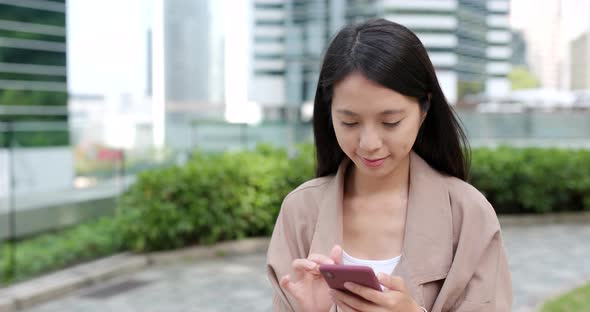 Woman use of cellphone at outdoor