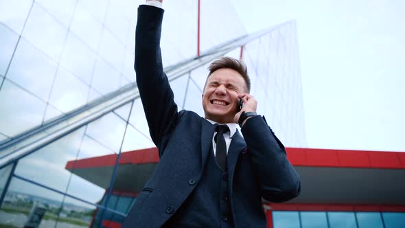 Successful Businessman Overjoyed With Phone