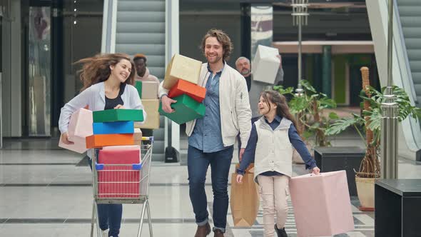 Happy Group of People Spending Weekends in the Shopping Mall