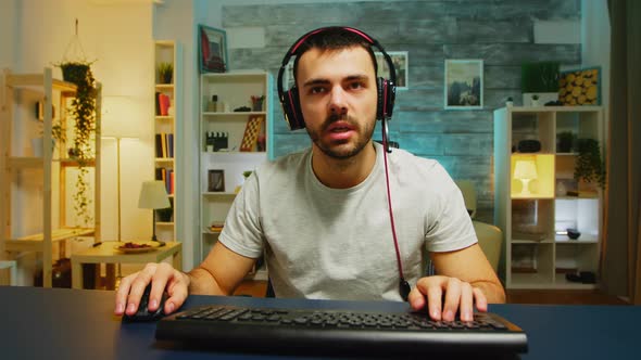 Professional Gamer Keeping His Head on the Office