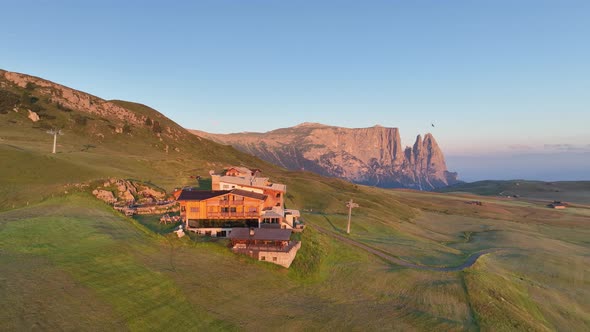 Dolomites mountains peaks with a hiking path on a summer sunrise