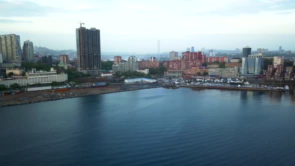 Drone View of the City and Marina Located on the Peninsula at Sunset