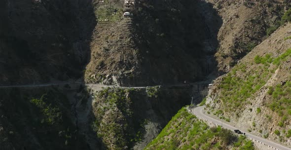 Aerial View Of Winding Road On Mountainside In Swat Valley. Dolly Forward, Pan Right