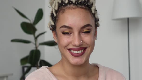 Young Trendy Beautiful Woman Smiling at Home