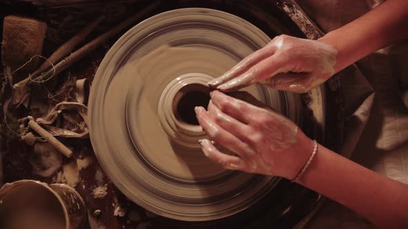 Young Woman Potter Working with a Wet Clay