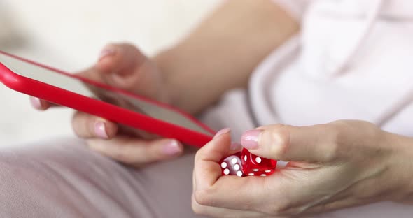 Smartphone with Game Red Cubes in Hand Closeup