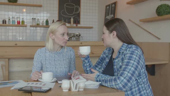 Coffee Break of Female Freelancers Working in Cafe