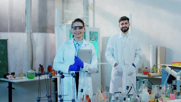 Smiling Charismatic Scientist Female and Man in