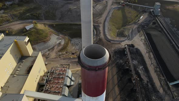 High resolution aerial view of two cooling towers belonging to gas and coal generating station. Slow