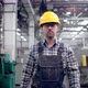 Engineer in Hard Hat is Moving Through a Heavy Industry Factory with a Tablet Computer - VideoHive Item for Sale