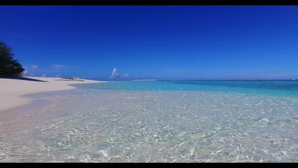 Aerial panorama of exotic lagoon beach break by shallow lagoon and white sand background of a dayout