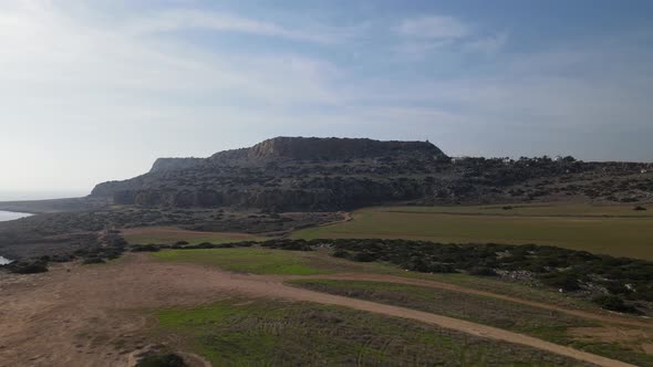 View of the majestic mountain. Aerial video filming. Mediterranean sea and fields.