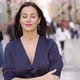 Smiling Woman Standing on Street and Looking at Camera - VideoHive Item for Sale