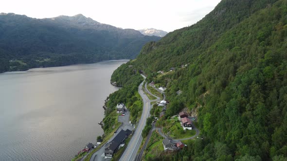 krafjorden Norway - Aerial overview of road and popular stopping spot along fjord - Sunset in mount