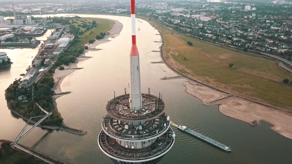 Rheinturm  Barge Sailing Across Rhine River Near Rhine Tower In Dusseldorf Germany