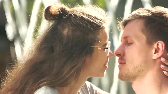 Summer Young Couple in Love Kissing Outdoors