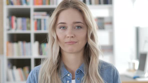 Young Woman Gesturing No by Shaking Head