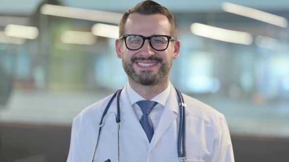 Portrait of Young Male Doctor Smiling at Camera