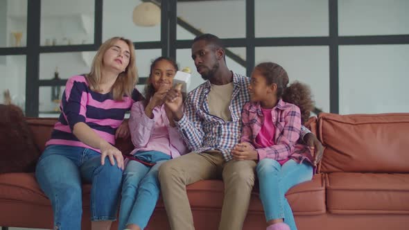 Diverse Family with Kids Singing Karaoke at Home