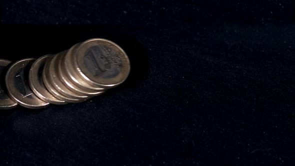 700418 Coins of 1 Euros Falling against Black Background, Slow motion