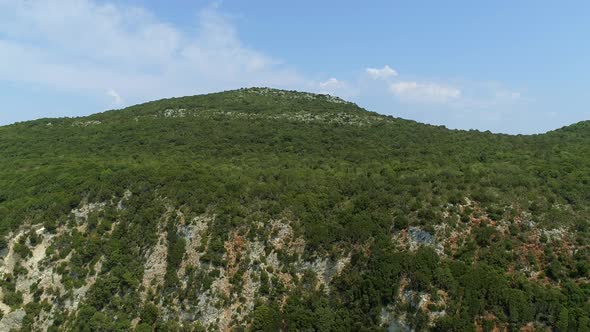 Aerial view of mountain peak on the coast, Greece.