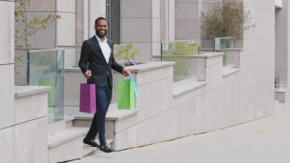 Happy About Nice Things Bought African Ethnicity Bearded Businessman Coming Out of Store