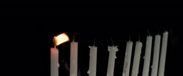 Hanukkah menorah candles being blown out, slow motion