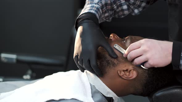 Barber Shaving His Client with Classical Razor