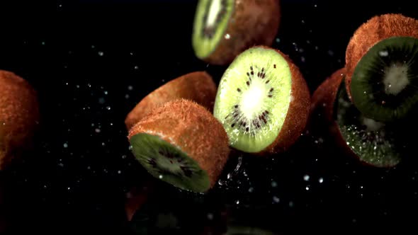 Super Slow Motion Kiwi Halves Fall on the Table