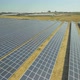 Aerial footage of hundreds solar energy modules or panels rows along the dry lands - VideoHive Item for Sale
