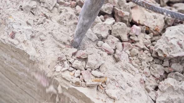 Flying Dust and Chips From the Destruction of a Concrete Structure with a Jackhammer