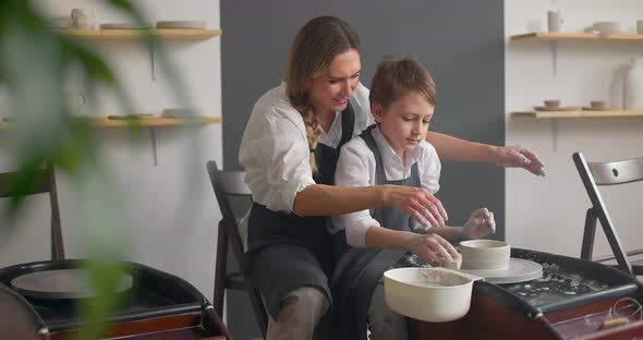 Child Boy and His Mother on a Pottery Master Class