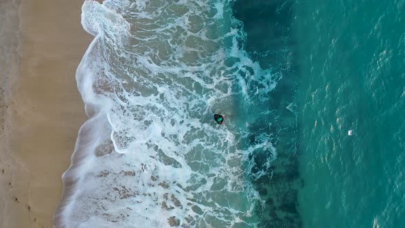 Fisherman Catches Fish in a Net From the Seashore Aerial View 4 K