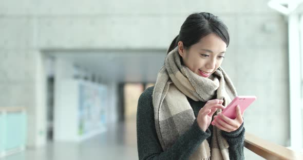 Woman use of smart phone in campus