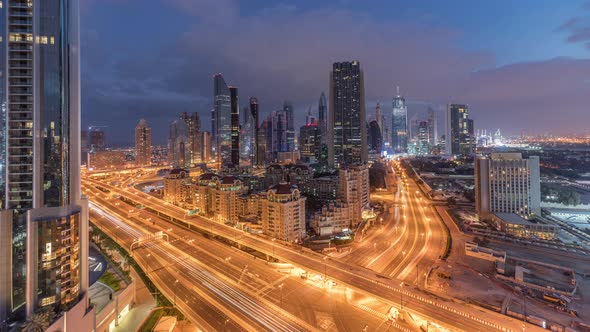 Skyline View of the Buildings of Sheikh Zayed Road and DIFC Night to Day Timelapse in Dubai UAE