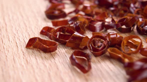 Red chopped dried hot peppers on a wooden surface