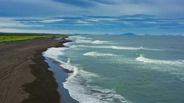 Beach with Black Sand and Volcano