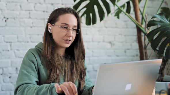 Serious White Girl Student Typing on Laptop Preparing Course Work