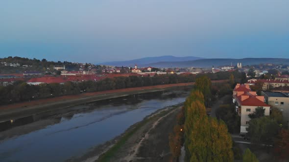 Panoramic view on a small city at sunrise above in the autumn over the Uzh Rive