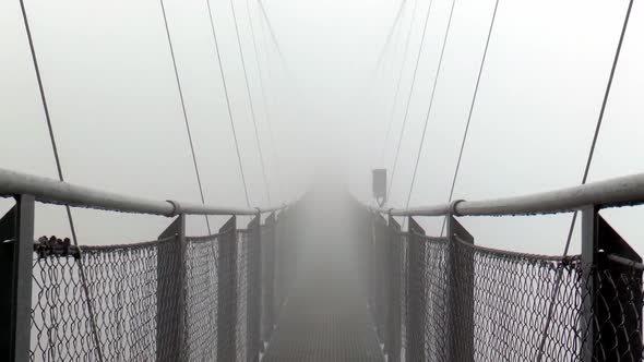 Europe's highest suspension bridge in the fog.The suspension bridge is located on the Stubnerkogel