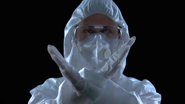 Female in White Uniform Crossing Hands, Restricting Access, Secret Experiments