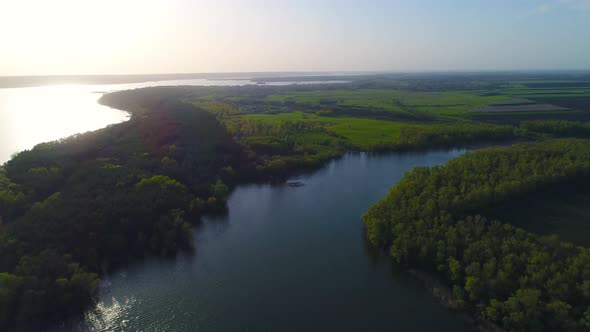 Flying Over the Beautiful Spring River. Aerial Camera Shot. Ukraine